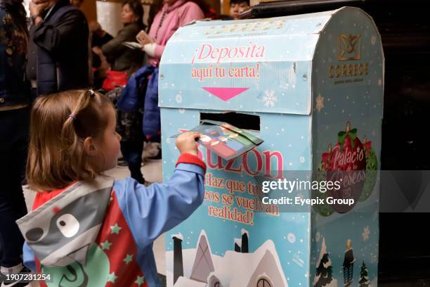 January 2 Mexico City, Mexico: Girls and boys come to the Postal Palace to write their letters for the Three Wise Men or Holy Kings prior to their...