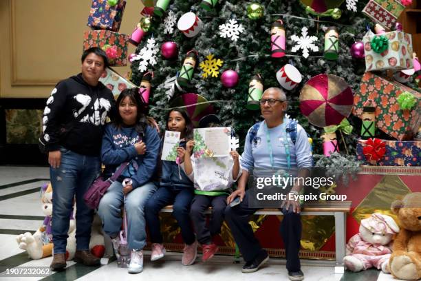 January 2 Mexico City, Mexico: Girls and boys come to the Postal Palace to write their letters for the Three Wise Men or Holy Kings prior to their...