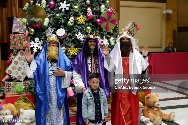 January 2 Mexico City, Mexico: The Holy Kings or Three Wise Men attend to children who come to the Postal Palace to write their letters to ask for...