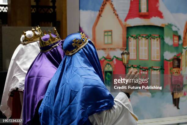 January 2 Mexico City, Mexico: The Holy Kings or Three Wise Men attend to children who come to the Postal Palace to write their letters to ask for...