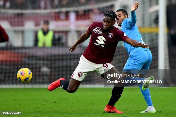 Torino's Colombian forward Duvan Zapata fights for the ball with Napoli's Brazilian defender Juan Jesus during the Italian Serie A football match...