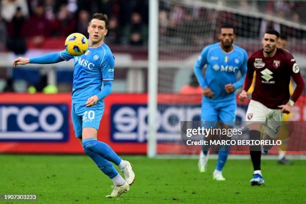 Napoli's Polish midfielder Piotr Zielinski controls the ball during the Italian Serie A football match Torino vs Napoli at the "Stadio Grande Torino"...