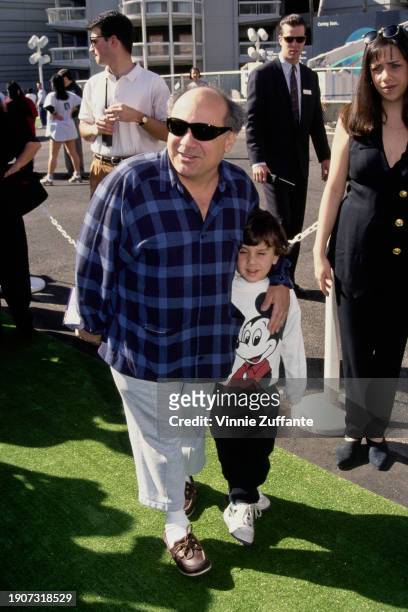 American actor and filmmaker Danny DeVito, with his son, attends the premiere of "Teenage Mutant Ninja Turtles III" at the Cinerama Dome Theater in...