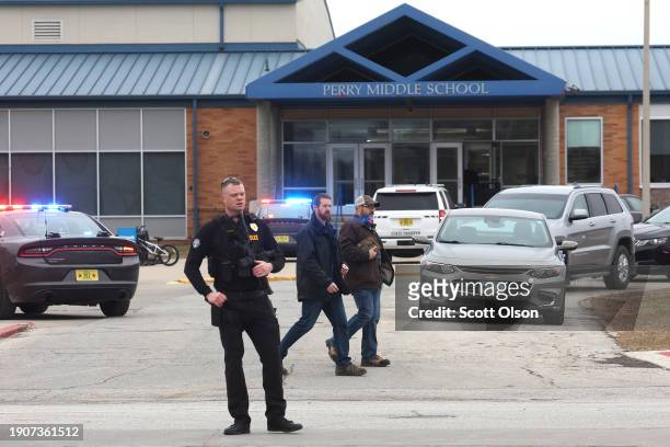Police respond to a school shooting at the Perry Middle School and High School complex on January 04, 2024 in Perry, Iowa. Students were returning to...