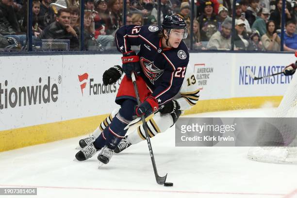 Jake Bean of the Columbus Blue Jackets controls the puck during the game against the Boston Bruins at Nationwide Arena on January 2, 2024 in...