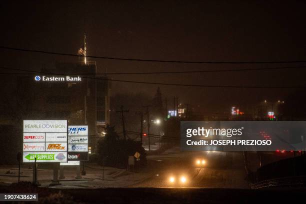 Cars and trucks make their way on US route one South towards Boston though a Nor'easter winter storm in Saugus, Massachusetts on January 7, 2024....