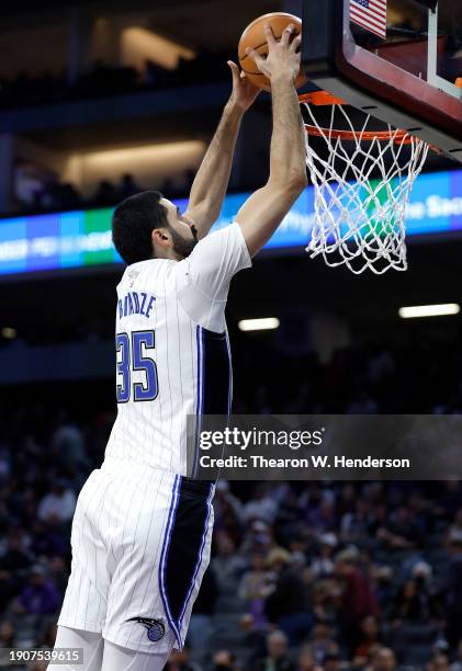 Goga Bitadze of the Orlando Magic slam dunks against the Sacramento Kings during the second half of an NBA basketball game at Golden 1 Center on...