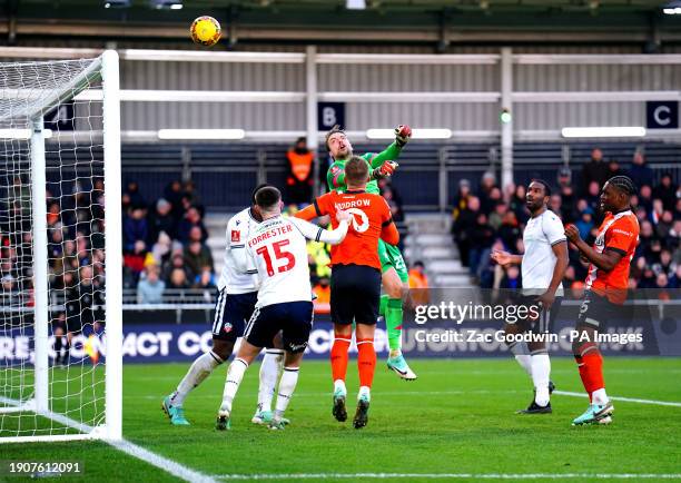 Luton Town goalkeeper Tim Krul attempts to clear the ball during the Emirates FA Cup Third Round match at Kenilworth Road, Luton. Picture date:...
