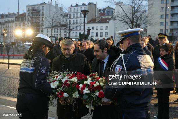 Grand Rabbi of France Haim Korsia and President of the 'Consistoire central israelite de France' Elie Korchia lay a wreath during a commemoration...