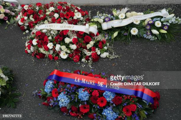 Photo shows wreaths layed during a commemoration ceremony marking the ninth anniversary of the jihadist attack on satirical magazine Charlie Hebdo,...