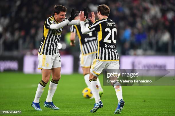 Fabio Miretti of Juventus celebrates with teammate Andrea Cambiaso after scoring their team's first goal during the Coppa Italia Round of 16 match...