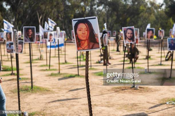 Photos of people killed or kidnapped during the Hamas attack on the Super Nova festival on October 7th are displayed in a temporary memorial site on...