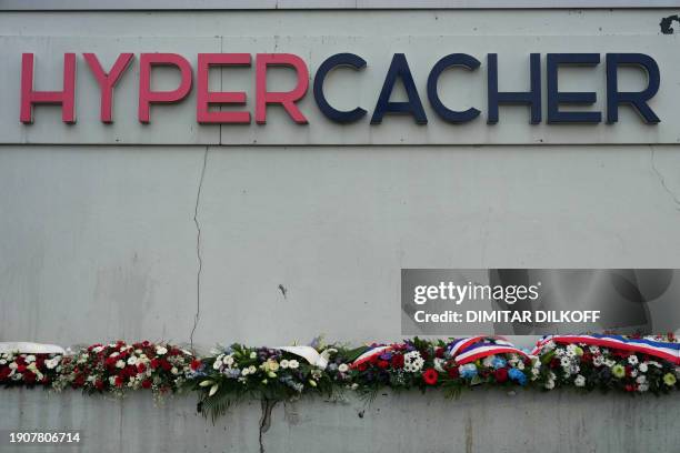 Photo shows wreaths layed during a commemoration ceremony marking the ninth anniversary the jihadist attack on the Hyper Cacher Jewish supermarket,...