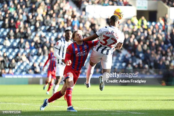 Jovan Malcolm of West Bromwich Albion collides with Ryan Glover of Aldershot Town during the Emirates FA Cup Third Round match between West Bromwich...