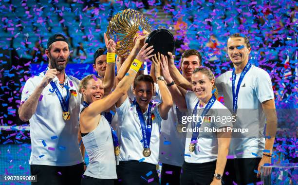 Torben Beltz, Maximilian Marter, Laura Siegemund, Angelique Kerber, Tatjana Maria & Aleanxder Zverev of Germany pose with the champions trophy after...