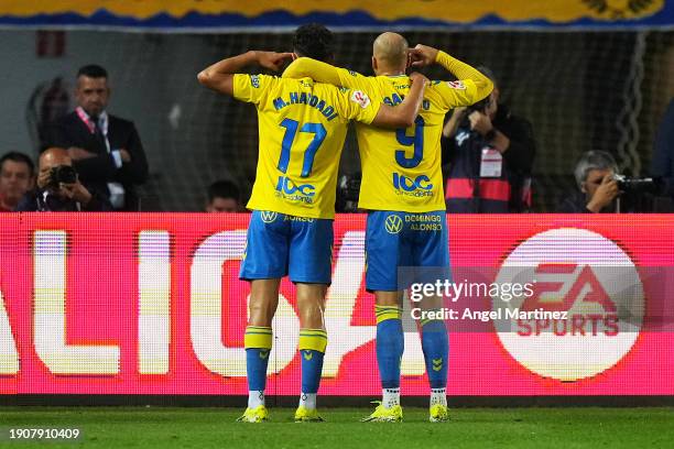 Munir El Haddadi of UD Las Palmas celebrates with teammate Sandro Ramirez after scoring their team's first goal during the LaLiga EA Sports match...