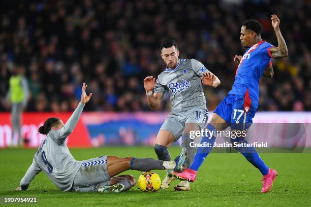 Nathaniel Clyne of Crystal Palace is challenged by Dominic Calvert-Lewin and Jack Harrison of Everton, leading to a red card for Dominic...