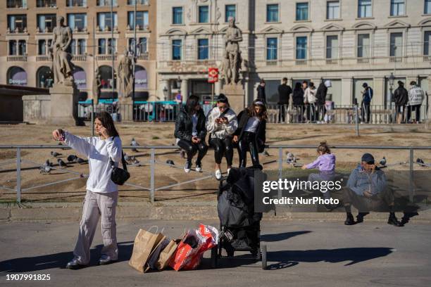Tourists are taking advantage of their vacation and shopping in the city center on the first day of winter sales in Barcelona, Spain, on January 7,...