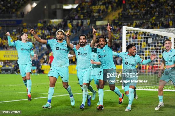 Ilkay Gundogan of FC Barcelona celebrates with teammates after scoring their team's second goal from a penalty during the LaLiga EA Sports match...
