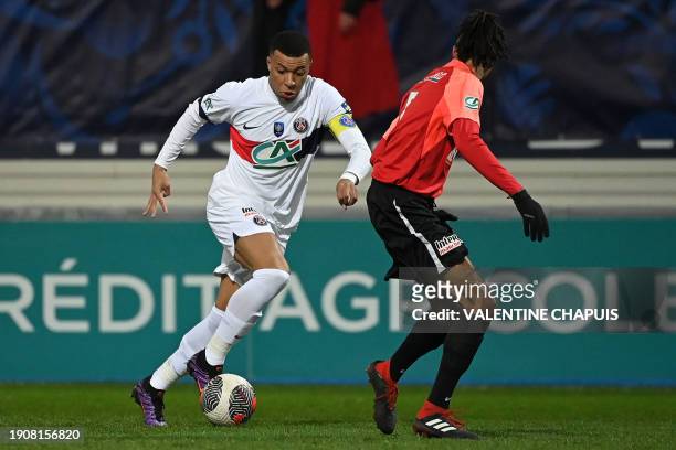 Paris Saint-Germain's French forward Kylian Mbappe controls the ball during the French Cup football match between US Revel and Paris Saint-Germain at...