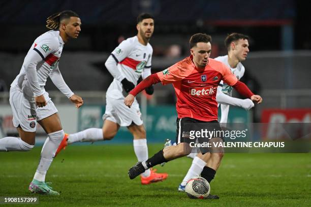 Revel's French defender Pierre-Antoine Palacios runs with the ball during the French Cup football match between US Revel and Paris Saint-Germain at...