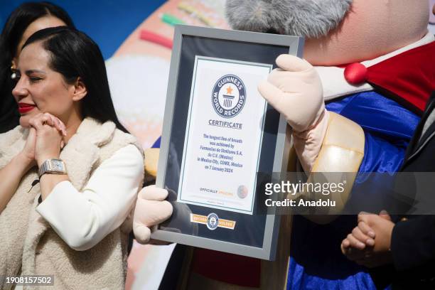 The World Guinness record certificate for the longest line of breads is seen after Mexico City set a new world record, in Mexico City, Mexico on...