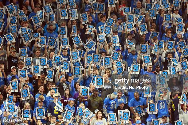 Fans wave third down signs in the stands during an NFL football game between the Detroit Lions and the Minnesota Vikings in Detroit, Michigan USA, on...