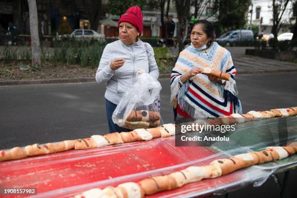 People take pieces of breads after Mexico City set a World Guinness record, in Mexico City, Mexico on January 07, 2024. Mexico City set a new World...