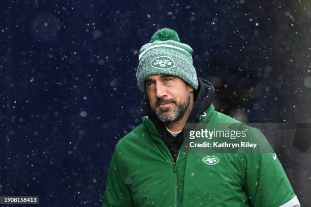 Aaron Rodgers of the New York Jets runs onto the field prior to the start of the game against the New England Patriots at Gillette Stadium on January...