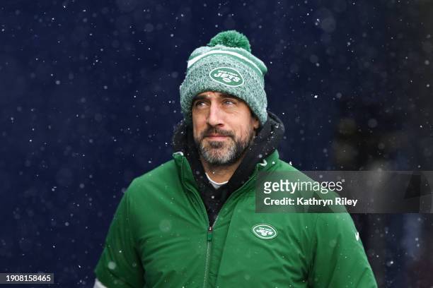 Aaron Rodgers of the New York Jets runs onto the field prior to the start of the game against the New England Patriots at Gillette Stadium on January...