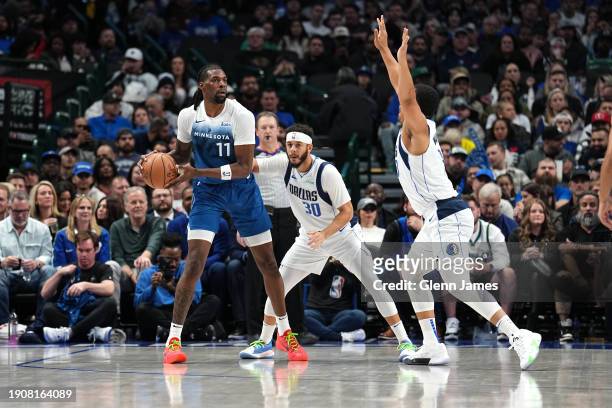 Naz Reid of the Minnesota Timberwolves looks to pass the ball during the game against the Dallas Mavericks on January 7, 2024 at the American...