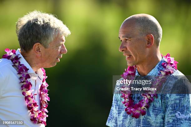 Executive Director of The Sentry tournament, Max Novena, talks with Sentry CEO Pete McPartland during the trophy ceremony The Plantation Course at...