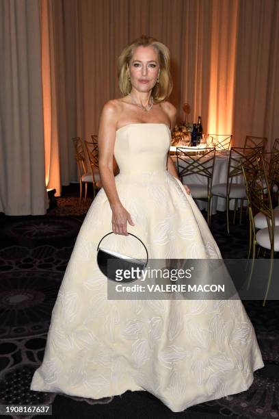 Actress Gillian Anderson poses at the Ballroom entrance of the 81st annual Golden Globe Awards at The Beverly Hilton hotel in Beverly Hills,...