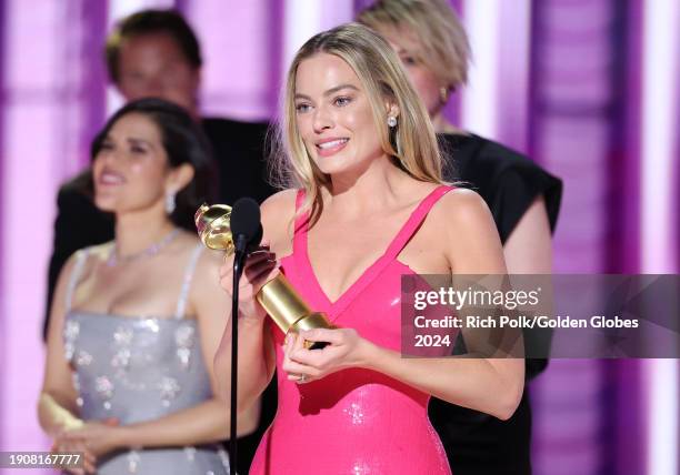 Margot Robbie accepts the award for Cinematic and Box Office Achievement for "Barbie" at the 81st Golden Globe Awards held at the Beverly Hilton...