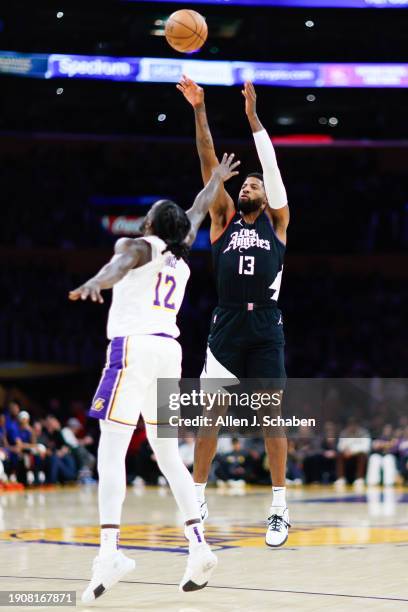 Clippers forward Paul George shoots a jump shot against Los Angeles Lakers forward Taurean Prince during the first half at Crypto.com Arena in Los...