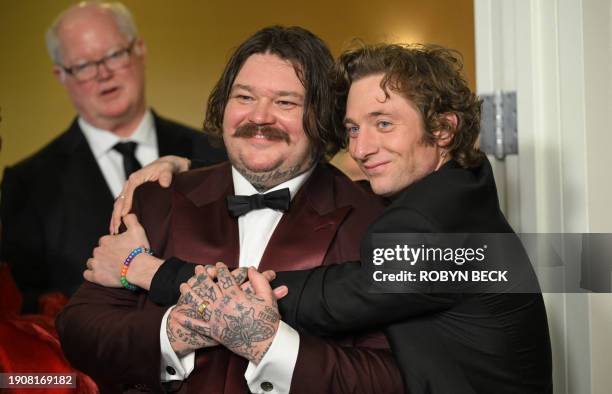 Actor Jeremy Allen White and Canadian chef Matty Matheson arrive in the press room during the 81st annual Golden Globe Awards at The Beverly Hilton...