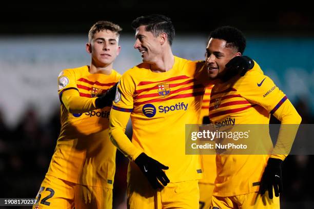 Robert Lewandowski centre-forward of Barcelona and Poland celebrates after scoring his sides first goal with Vitor Roque centre-forward of Barcelona...