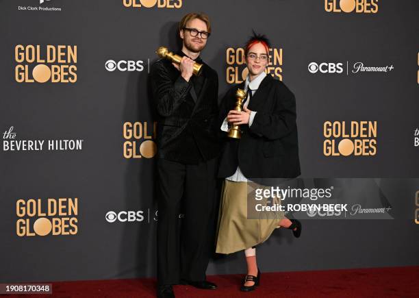 Musicians Billie Eilish and Finneas O'Connell pose with the award for Best Original Song - Motion Picture "What Was I Made For" from the movie...