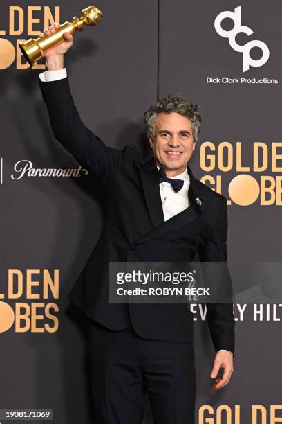 Actor Mark Ruffalo holds the award for Best Motion Picture - Musical or Comedy - "Poor Things" in the press room during the 81st annual Golden Globe...