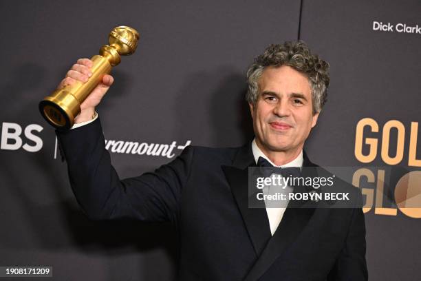 Actor Mark Ruffalo holds the award for Best Motion Picture - Musical or Comedy - "Poor Things" in the press room during the 81st annual Golden Globe...