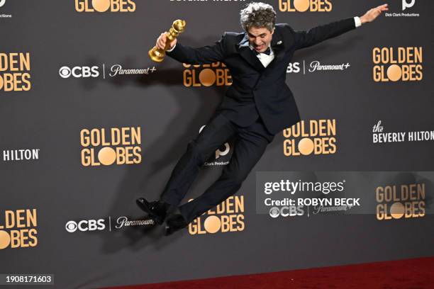 Actor Mark Ruffalo holds the award for Best Motion Picture - Musical or Comedy - "Poor Things" in the press room during the 81st annual Golden Globe...