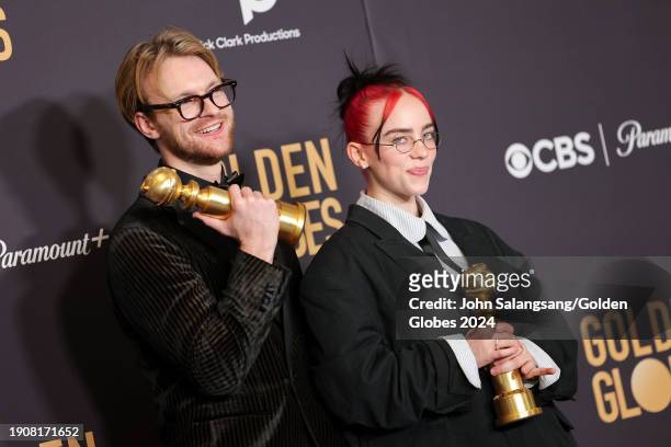 And Billie Eilish pose with the award for Best Original Song - Motion Picture for "What Was I Made For?" at the 81st Golden Globe Awards held at the...