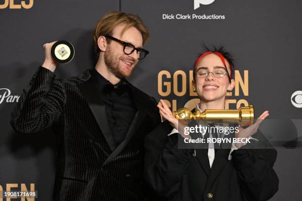 Musicians Billie Eilish and Finneas O'Connell pose with the award for Best Original Song - Motion Picture "What Was I Made For" from the movie...