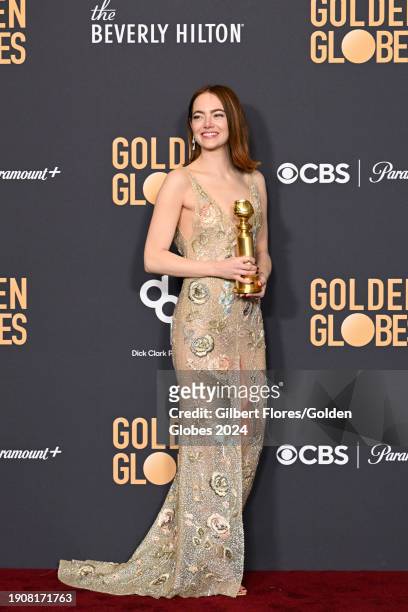 Emma Stone poses with the award for Best Performance by a Female Actor in a Motion Picture Musical or Comedy for her role in "Poor Things" at the...