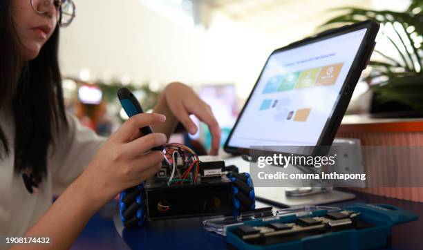 girl doing and learning robot kit - science fair stock pictures, royalty-free photos & images