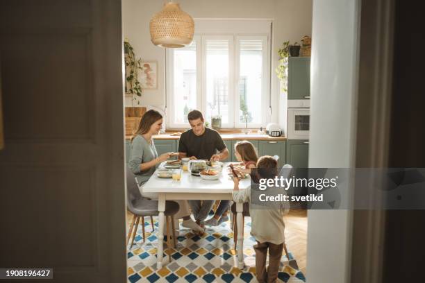 family breakfast - kitchen table stock pictures, royalty-free photos & images