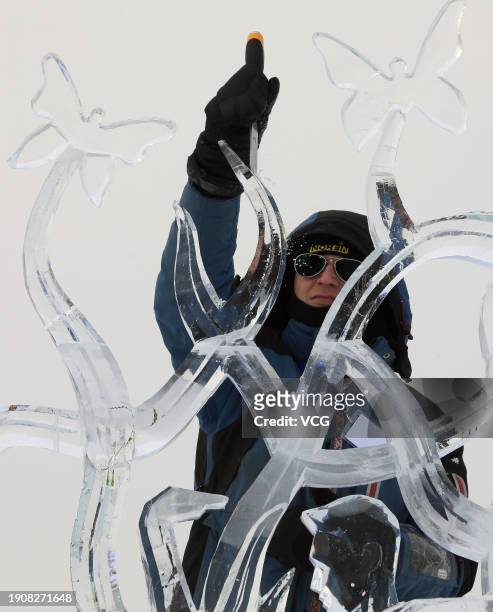 Competitor works on an ice sculpture during the 35th Harbin International Ice Sculpture Competition at Harbin Ice-Snow World on January 4, 2024 in...