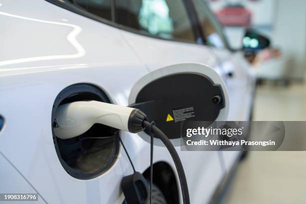 charging an electric car battery, new innovative technology ev electrical vehicle - electricity stock pictures, royalty-free photos & images