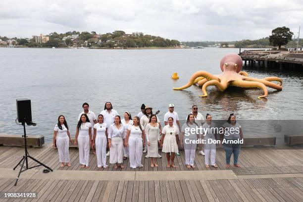 Traditional Māori song is performed by Te Aranganui choir against a backdrop of the giant inflatable octopus installation' Te Wheke-a-Muturangi: The...