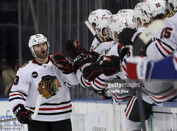 Colin Blackwell of the Chicago Blackhawks celebrates his goal with teammates on the bench during the second period against the New York Rangers at...